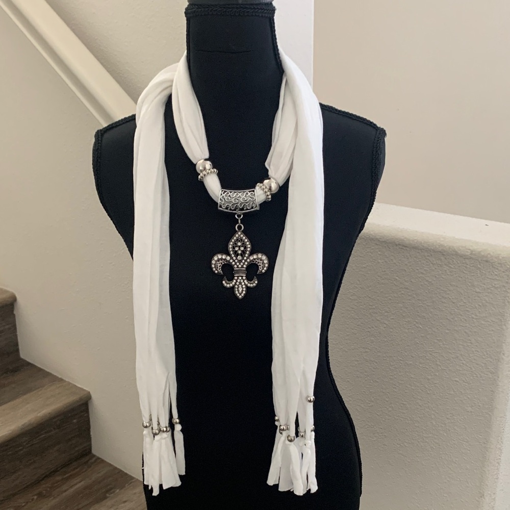 NWOT Chic White Scarf Necklace with Fleur-de-Lis Pendant.